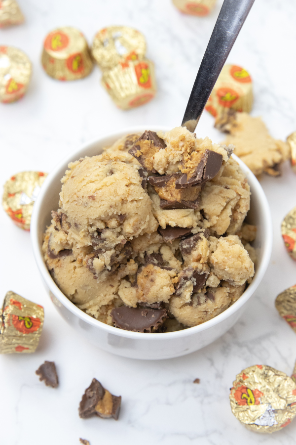 Reese's Peanut Butter Cup Edible Cookie Dough is a delicious and easy dessert for you to try out. This cookie dough has no eggs. #passion4savings #eggs #cookiedough #easy #reeses #peanutbutter #peanutbuttercups #edible #noegg peanut butter cookie dough