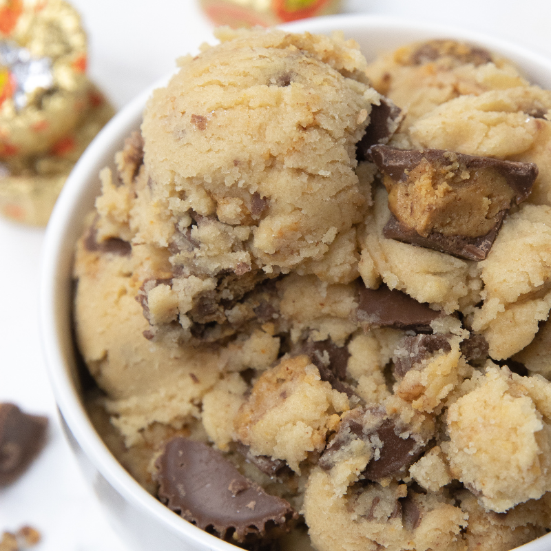 Reese's Peanut Butter Cup Edible Cookie Dough is a delicious and easy dessert for you to try out. This cookie dough has no eggs. #passion4savings #eggs #cookiedough #easy #reeses #peanutbutter #peanutbuttercups #edible #noegg peanut butter cookie dough