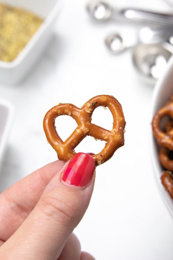 spicy flavored pretzel in hand 