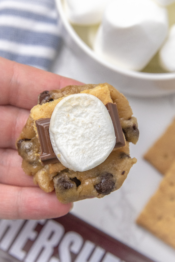 S'mores stuffed cookies are a loaded chocolate chip cookie. Loaded with graham cracker, chocolate and marshmallows in each bite! Give these cookies a try soon! #passion4savings #cookies #smores #stuffed #chocolatechip #marshmallows #grahamcracker stuffing cookies