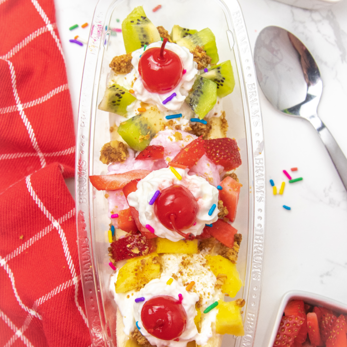 yogurt in a banana spit bowl with fruit on top 