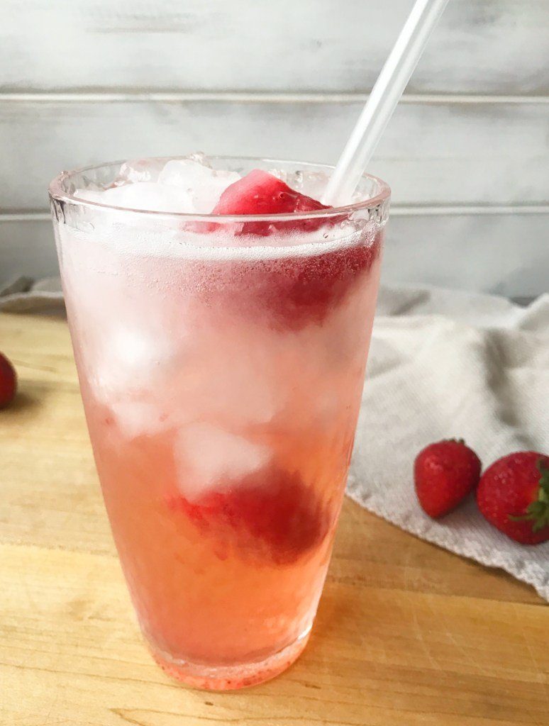 strawberry sprited drink on cutting board 