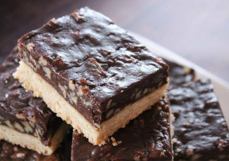 sliced pecan pie bars on platter 