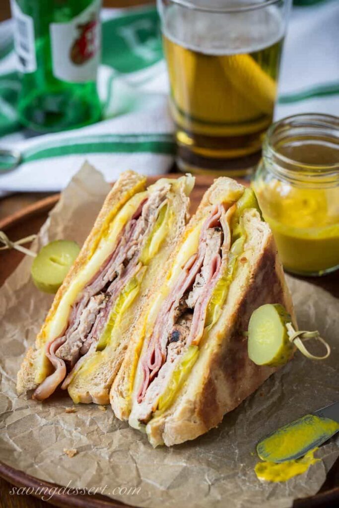 cuban sandwich wedge with toothpick stuck in it on plate 
