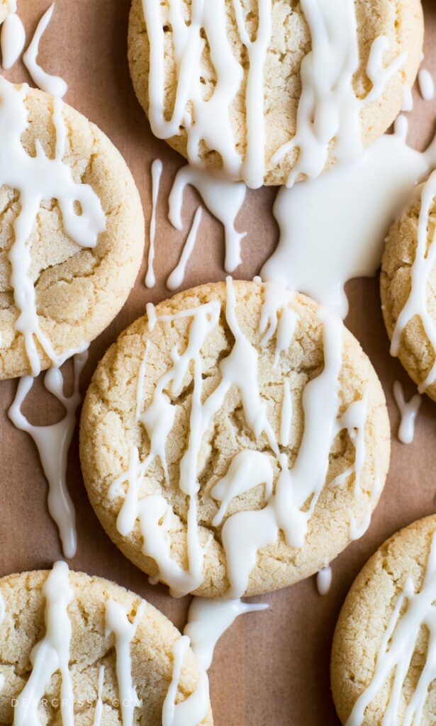 Serve up one or more of these maple recipes that are perfect for fall. From maple cookies to cheesecake, and more. A must make list! #passion4savings #maple #desserts #easy #homemade #fall #autumn #dessertrecipes #best maple syrup cookies with white icing drizzled on top