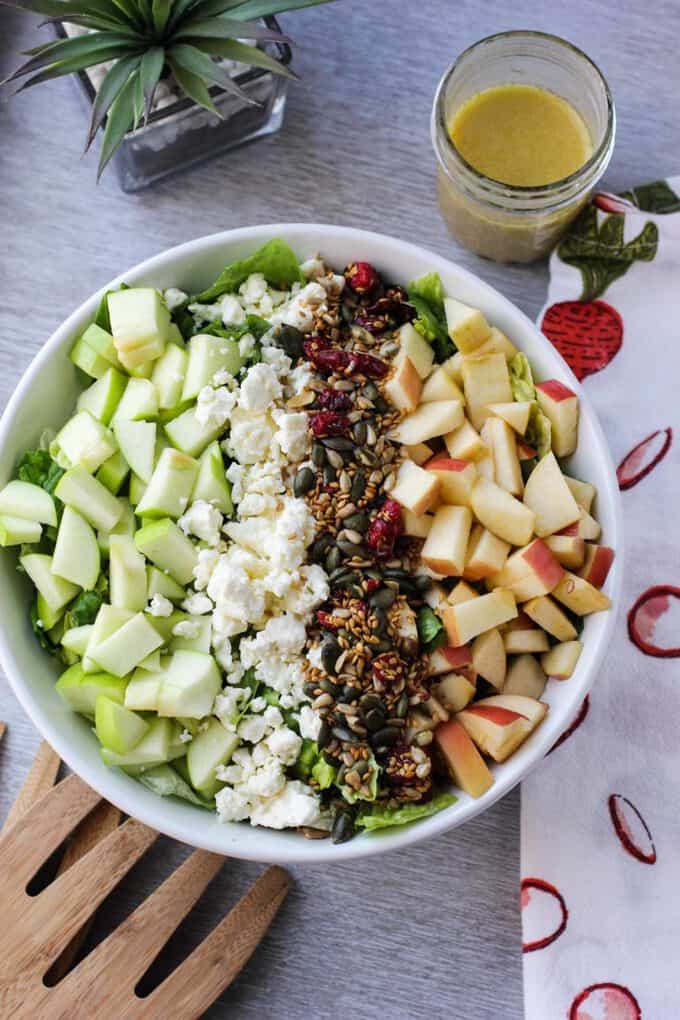overhead shot of salad with apples, cranberries, and more 