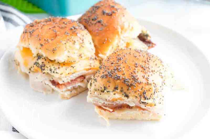 turkey and cheese sliders on white plate 