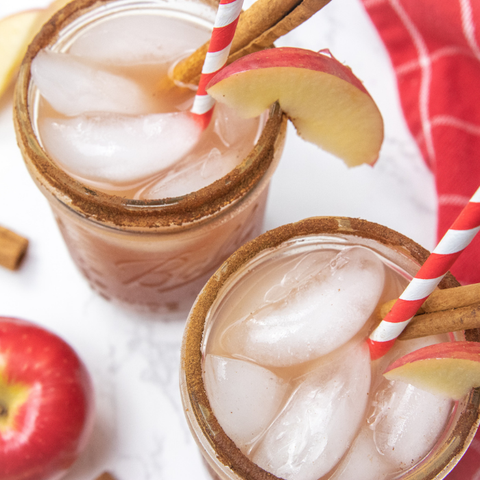 Apple Cider Punch is a refreshing and easy fall punch recipe the whole family can enjoy. A fizzy sweet apple cider drink recipe to try! #passion4savings #fall #drink #punch #family #kidfriendly #apple #applecider #drink #easy #quick overhead shot of drinks in glasses on counter