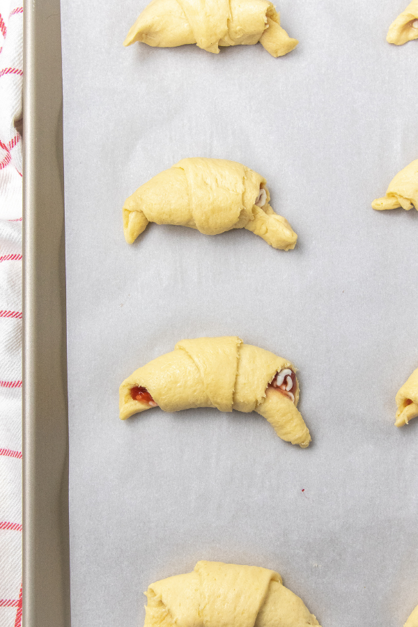 rolled up crescent rolls on baking dish