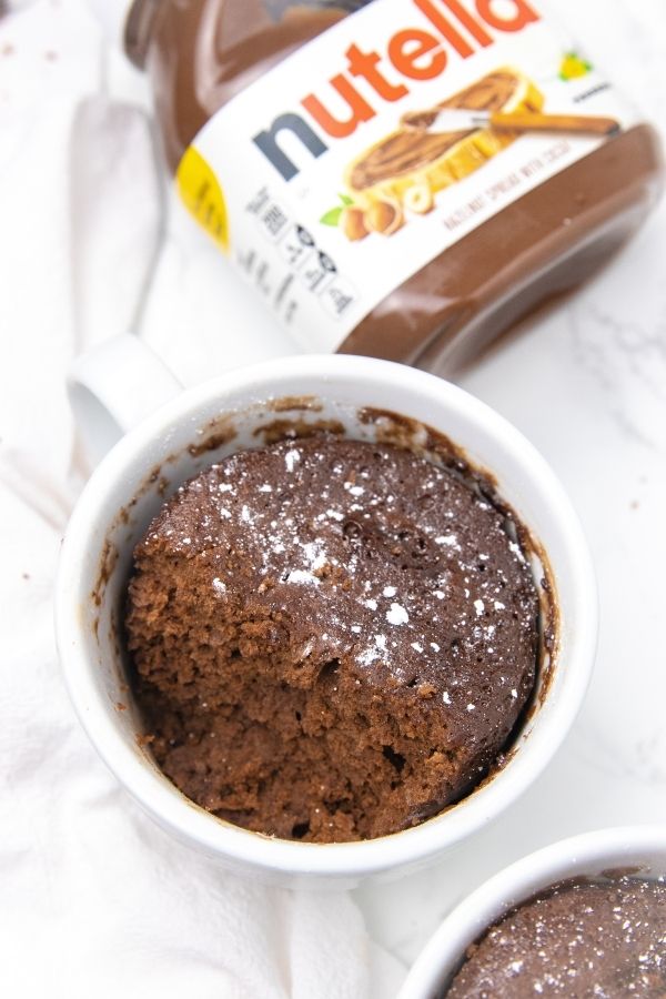3 ingredient nutella mug cake recipe is so simple to make. Just a few ingredients is all it takes and 2 minutes to cook. A single serve treat. #passion4savings #nutella #cake #dessert #easy #homemade #mugcake #mugdessert #nutellarecipe mug cake with soft nutella cake