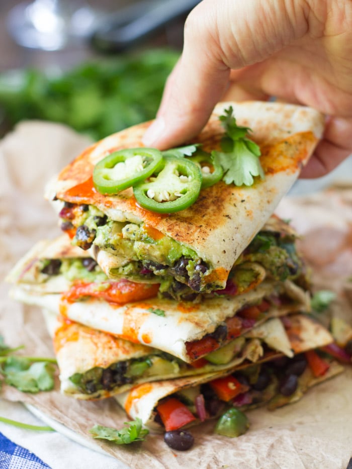 Avocado quesadillas stacked on top of each other 