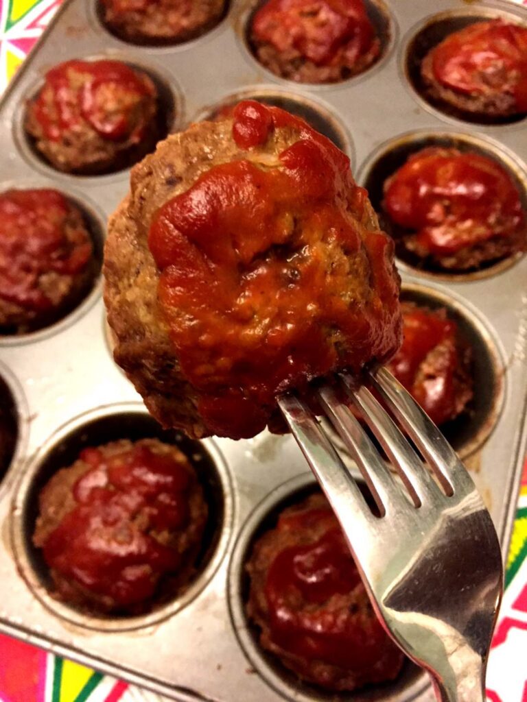 fork with muffin tin meatloaf bite on it 