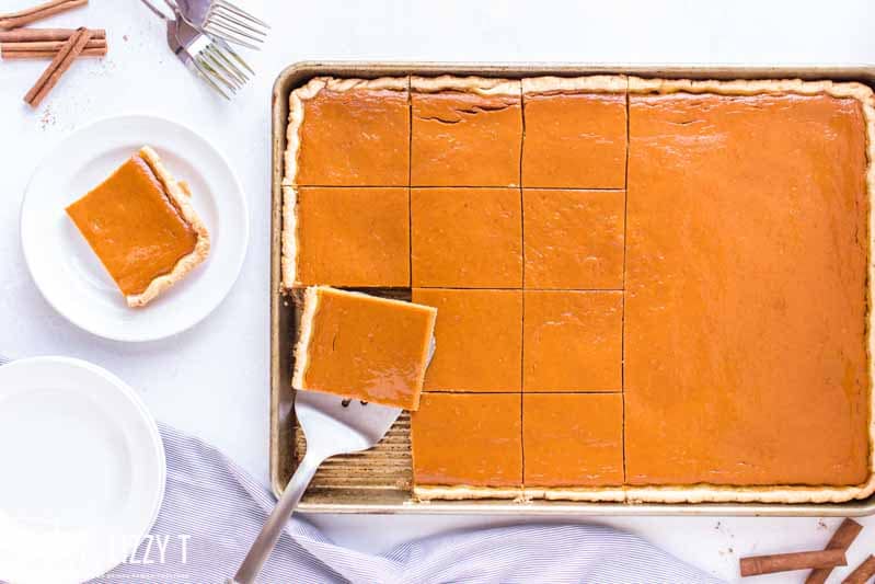 pumpkin pie in a sheet pan with part sliced