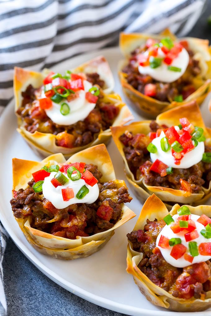 handful of taco cups on a white plate 