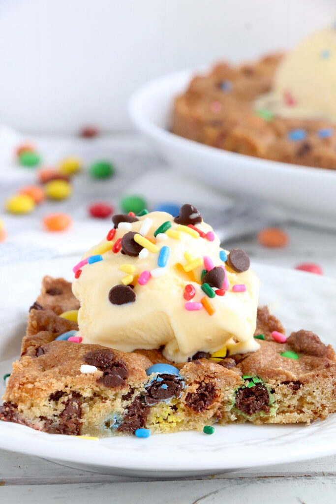 cookie cake with ice cream and sprinkles on top 