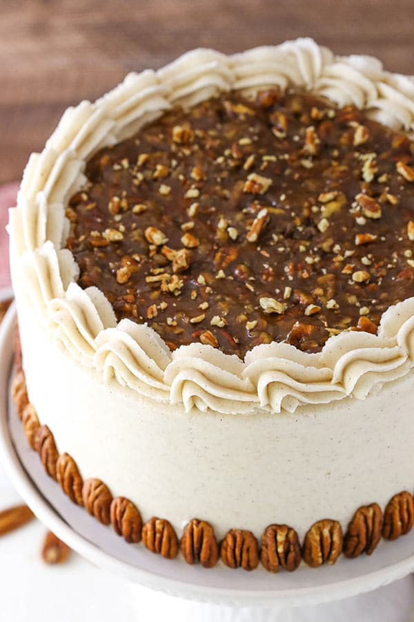 layered pecan pie cake on cake stand 