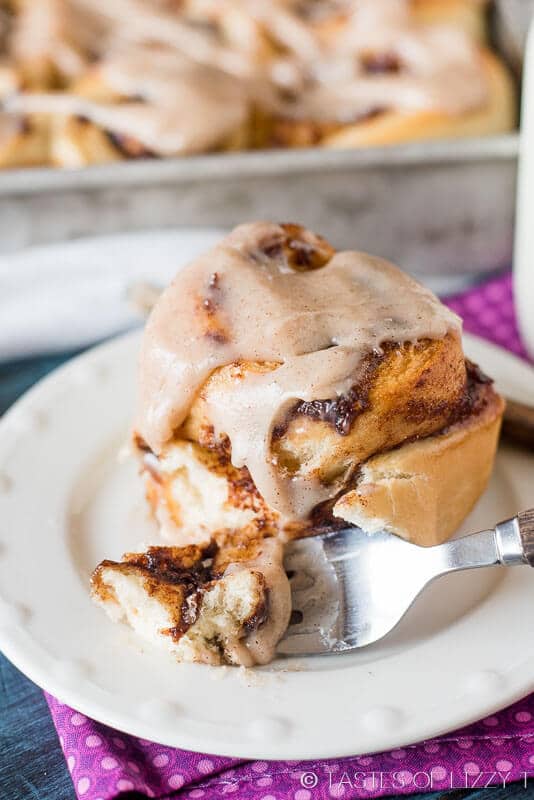 slice of apple butter cinnamon roll on plate with fork