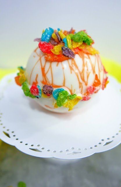 fruity pebble cocoa bomb on plate 