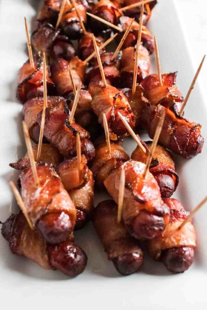 bacon wrapped smokies on a platter
