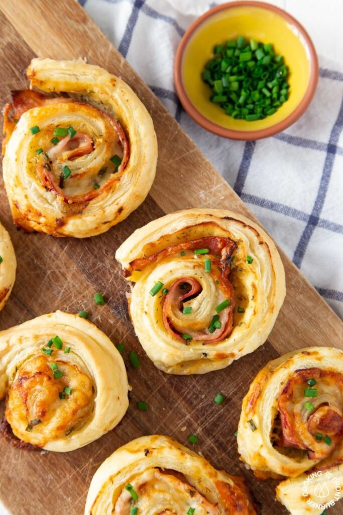 Puff Pastry Appetizers are a fun and easy appetizer that is a perfect finger food for your next party. This puff pastry recipe list is so good. #puffpastry #passion4savings #appetizer #snack #snackidea #partyfood #fingerfood #simple #delicious #fun puff pastry ham wheels