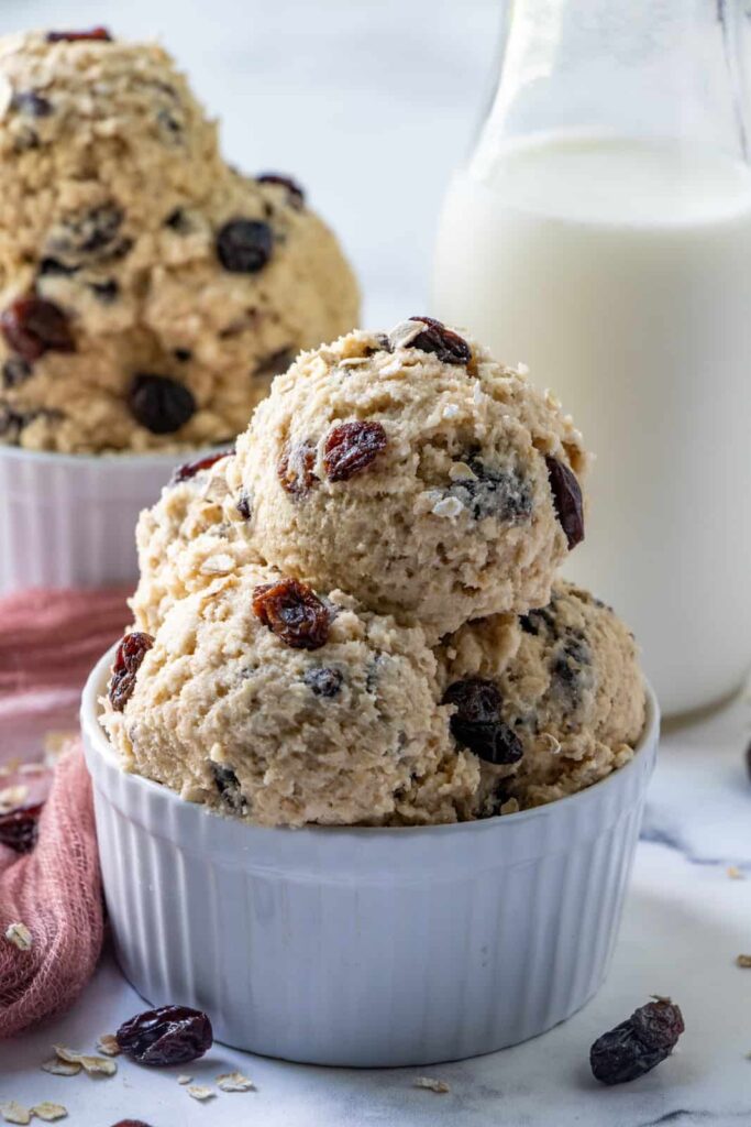 edible oatmeal raisin cookie dough in the bowl 