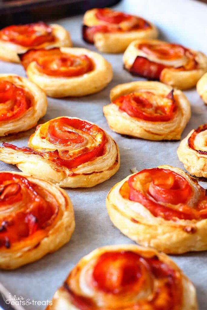 Puff Pastry Appetizers are a fun and easy appetizer that is a perfect finger food for your next party. This puff pastry recipe list is so good. #puffpastry #passion4savings #appetizer #snack #snackidea #partyfood #fingerfood #simple #delicious #fun pepperoni pinwheel
