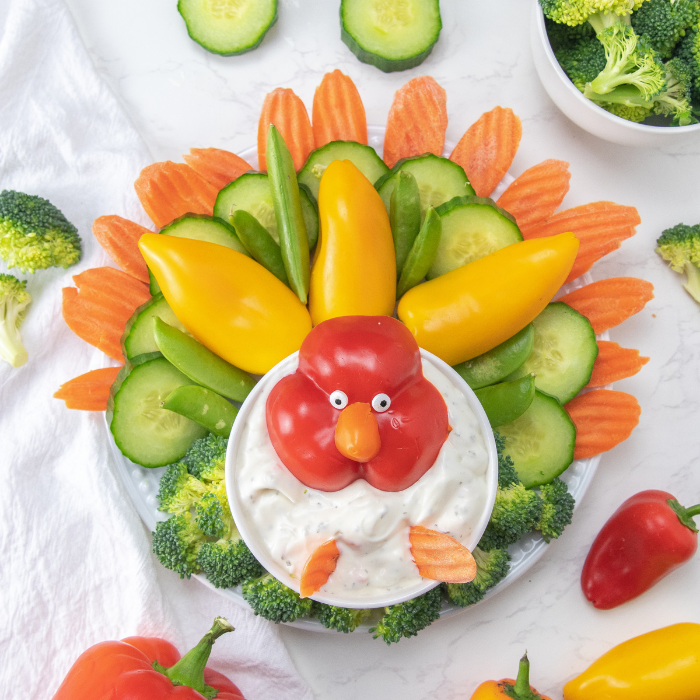 Serve up this festive and fun turkey veggie tray. A tasty Thanksgiving vegetable tray in the shape of a turkey. A kid-friendly snack idea. #passion4savings #thanksgiving #holiday #festive #fun #kidfriendly #vegetable #tray #thanksgiving #snack #cute #healthy turkey appetizer made with veggies