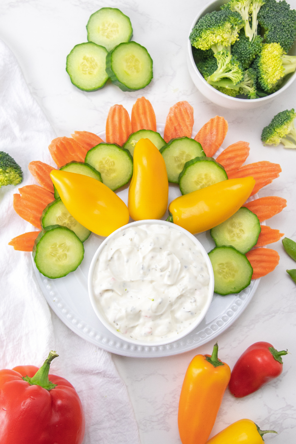 Serve up this festive and fun turkey veggie tray. A tasty Thanksgiving vegetable tray in the shape of a turkey. A kid-friendly snack idea. #passion4savings #thanksgiving #holiday #festive #fun #kidfriendly #vegetable #tray #thanksgiving #snack #cute #healthy Veggie Tray recipe