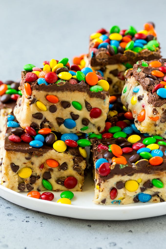 Check out these incredibly delicious Recipes for Cookie Dough Lovers! Simple, easy, and loaded with sweetness in every single bite. #passion4savings #dessert #cookiedough #easy #fun #simple #cake #cookies #cookiedoughrecipe #best #fromscratch stacked cookie dough bars on a plate