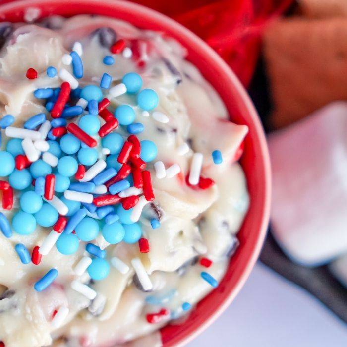 cookie dough dip in a red bowl on counter 