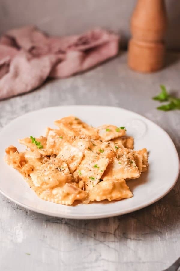 pumpkin alfredo pasta on a white dish 