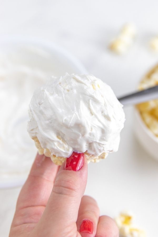 popcorn ball with white chocolate on it 