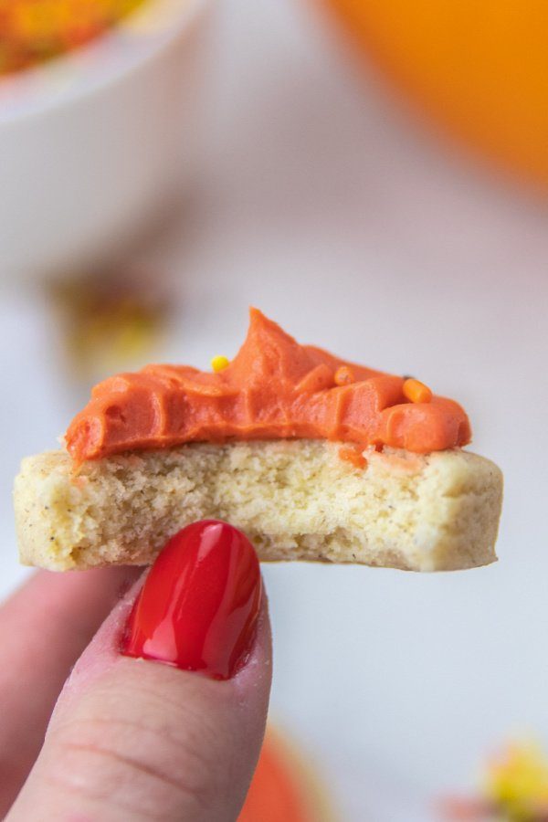 bite taken out of sugar cookies with frosting