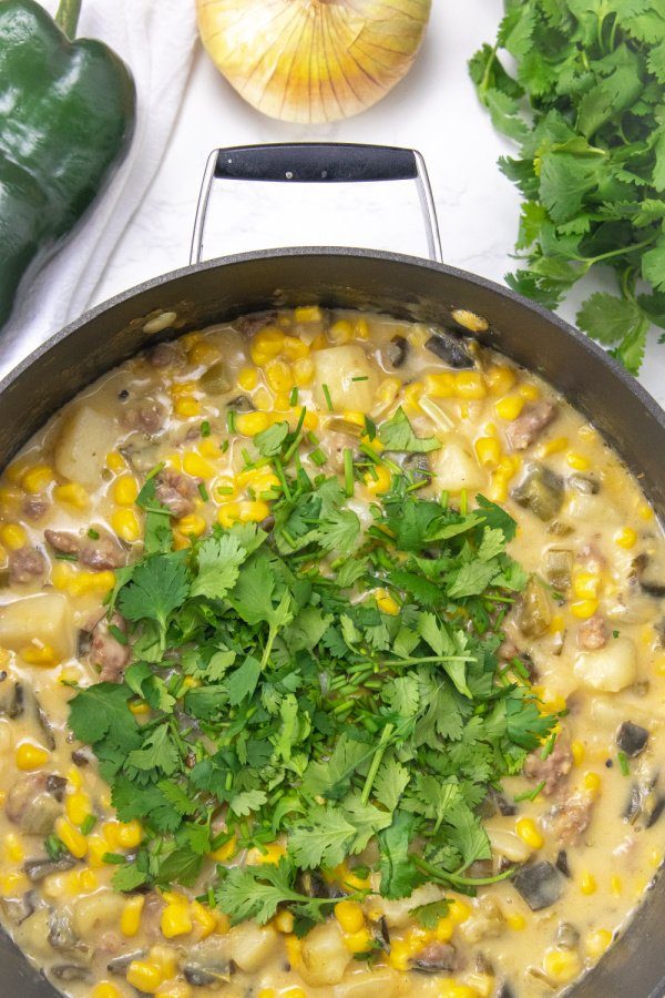 herbs on top of sausage poblano potato soup 