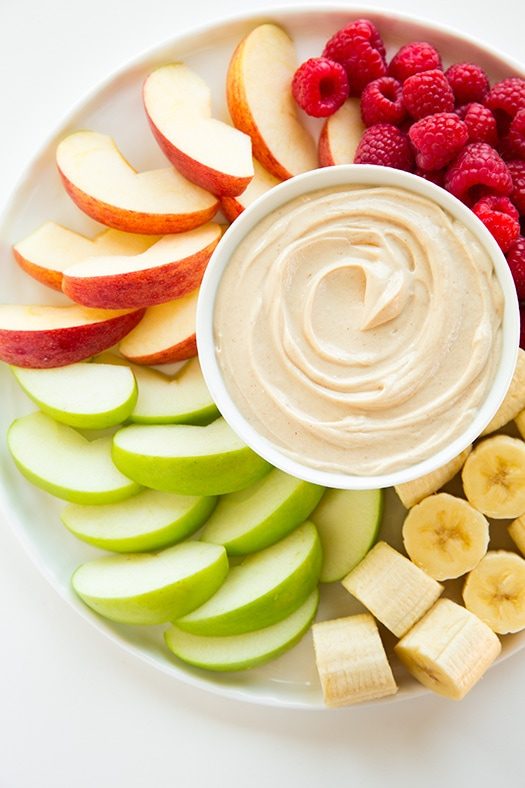 peanut butter dip on a platter with fruit