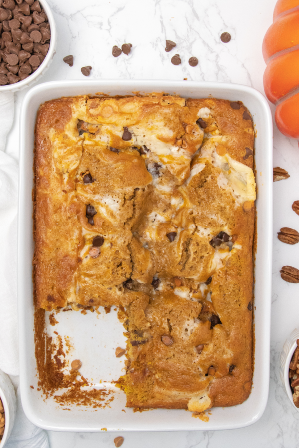 slice cut out of pumpkin cake in casserole dish