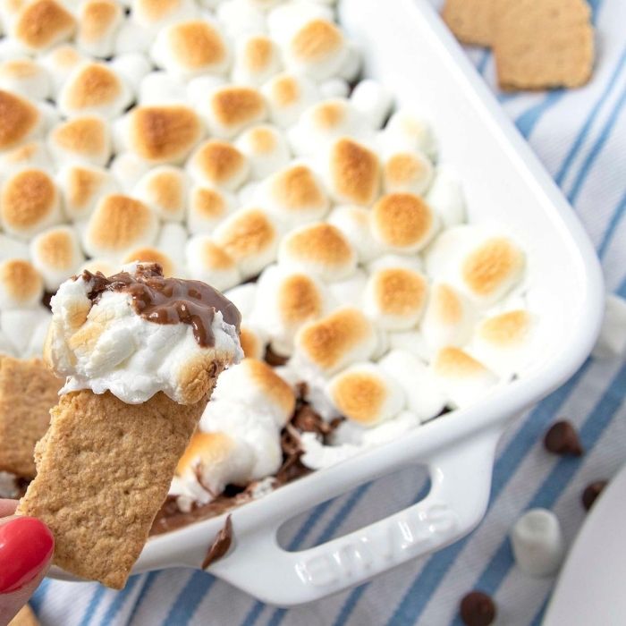 smores dip on a graham cracker