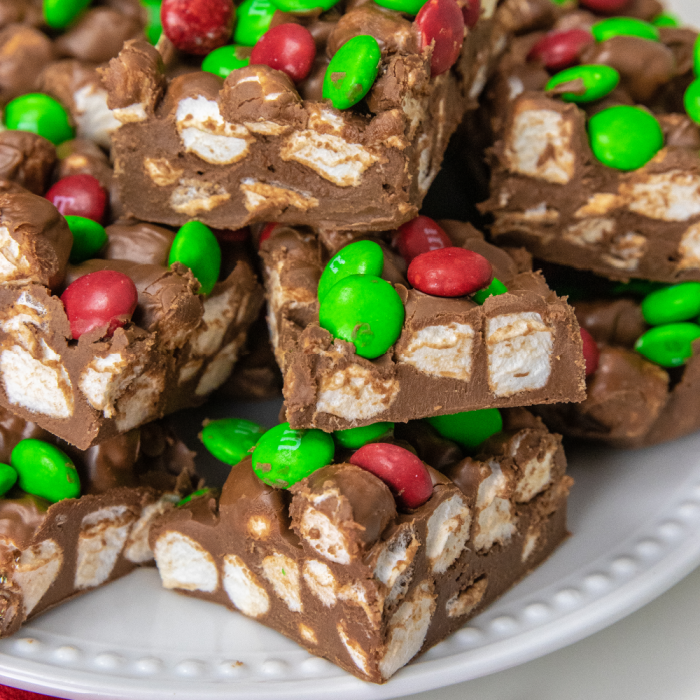 christmas candy stacked on a white plate
