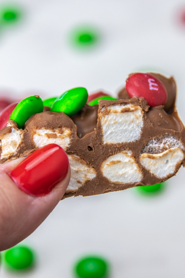 holding a dream bar in hand 