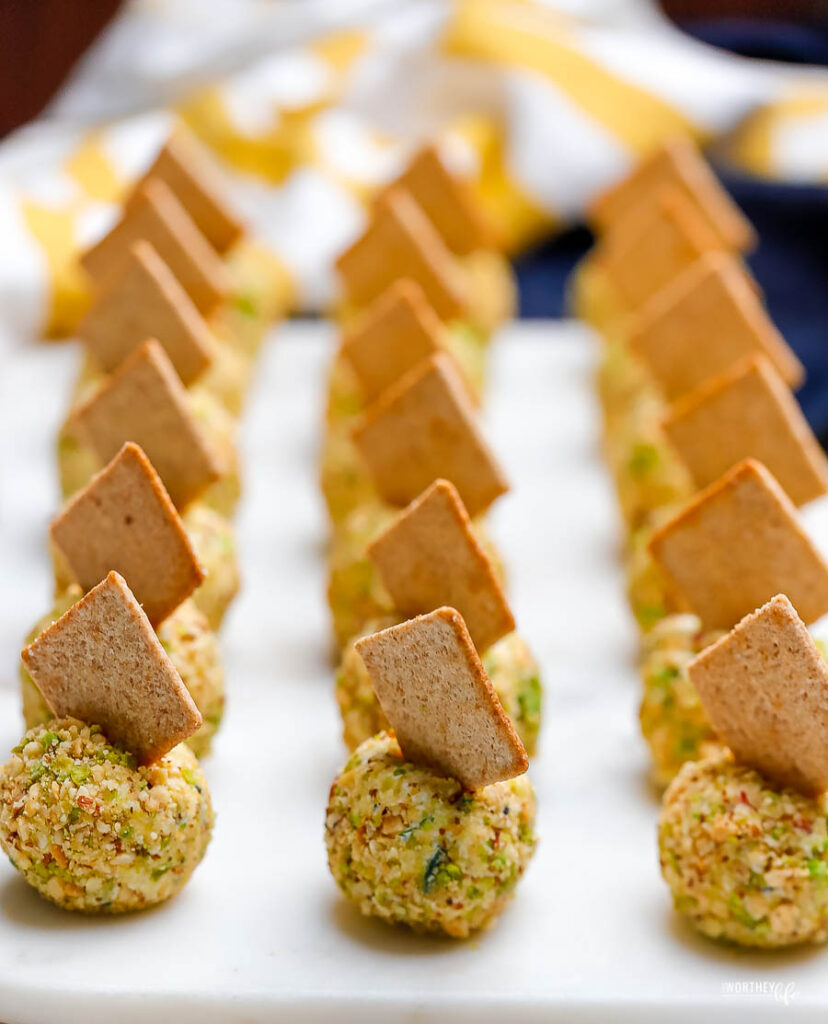 mini cheese ball bites on white platter 