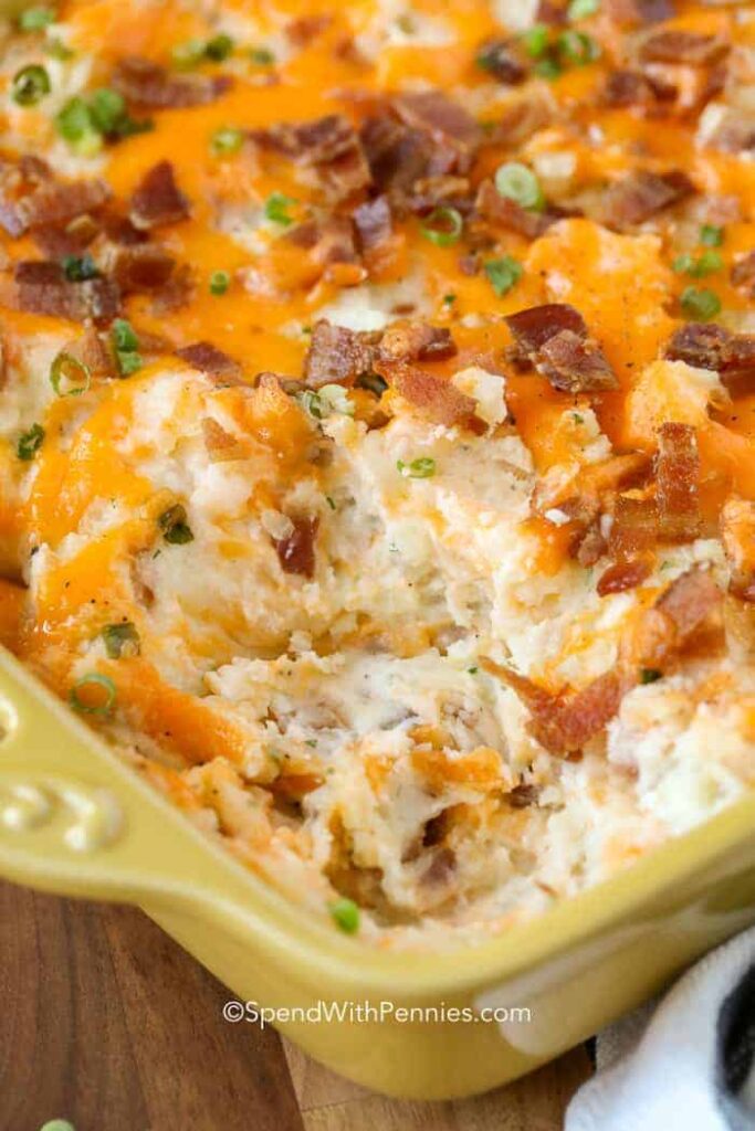 casserole with some scooped out on table 