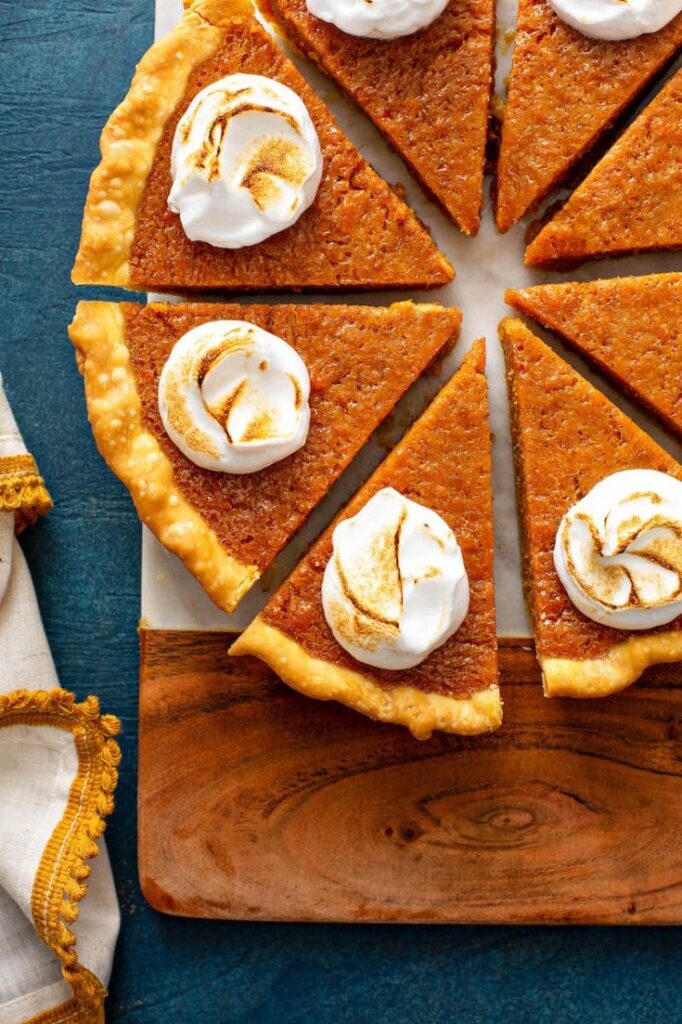 sweet potato pie on cutting board cut into single serve slices 