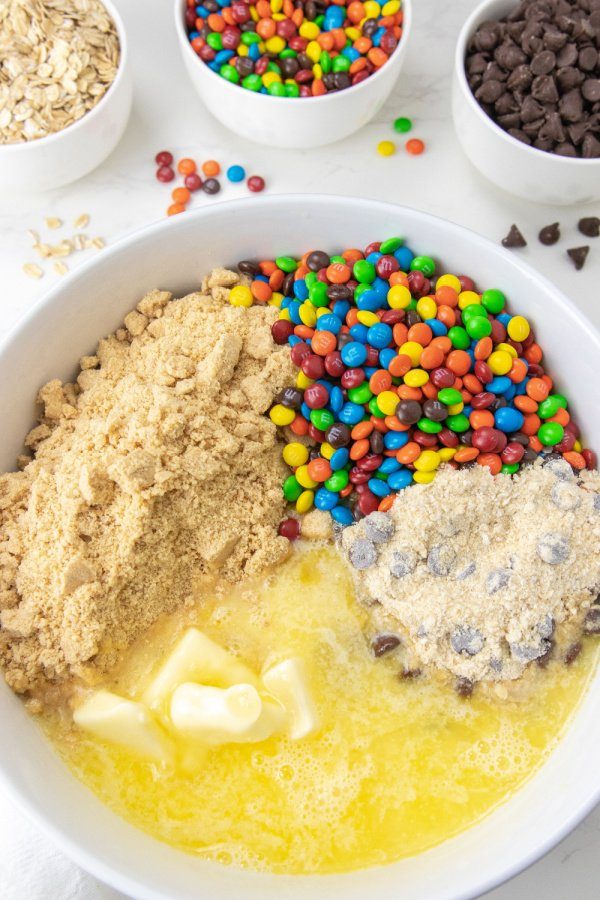 monster cookie batter in a white bowl 