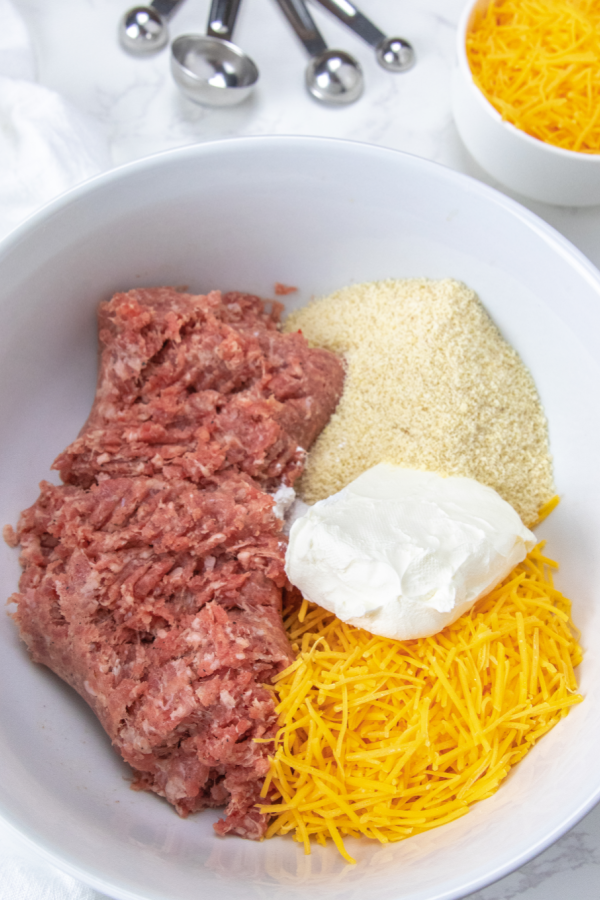 sausage, cheese and almond flour in mixing bowl 