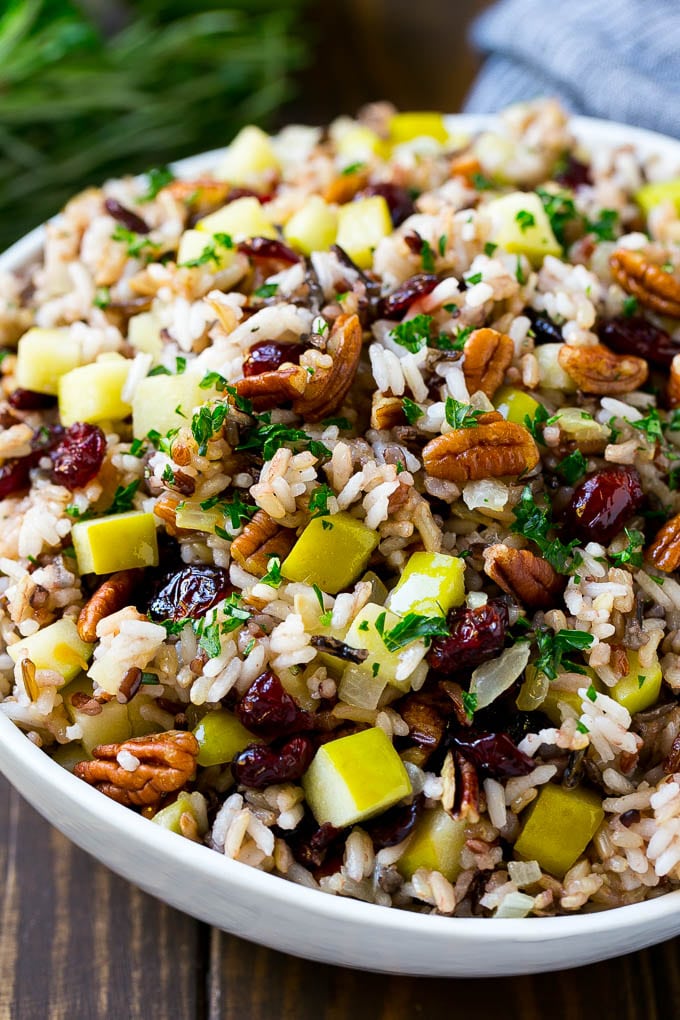 rice pilaf in a bowl with apples, pecans and cranberries 
