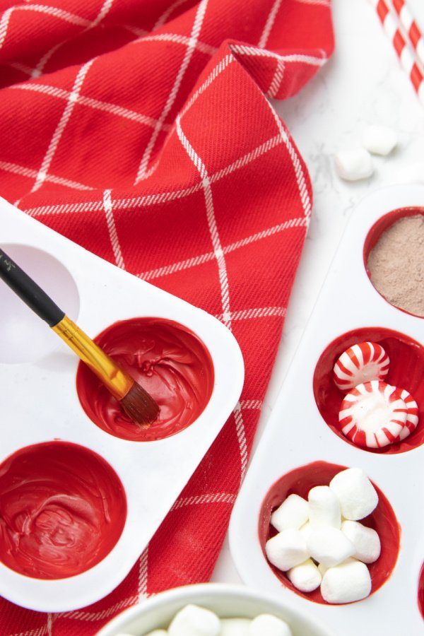 brushing chocolate in silicone mold 