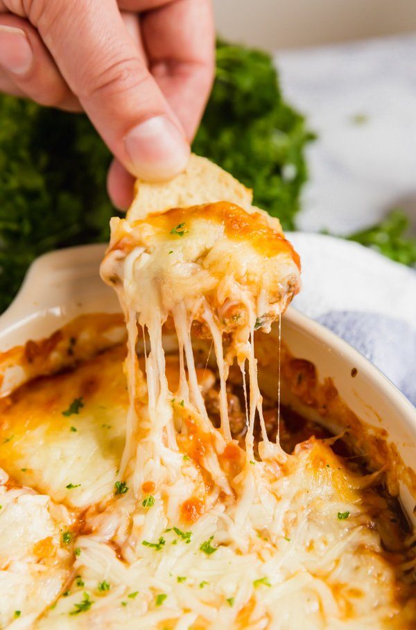 lasagna dip cheese pulling from the pan