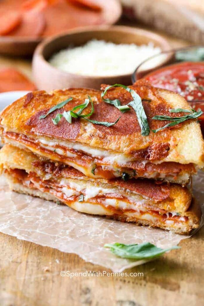 pizza grilled cheese cut open on plate