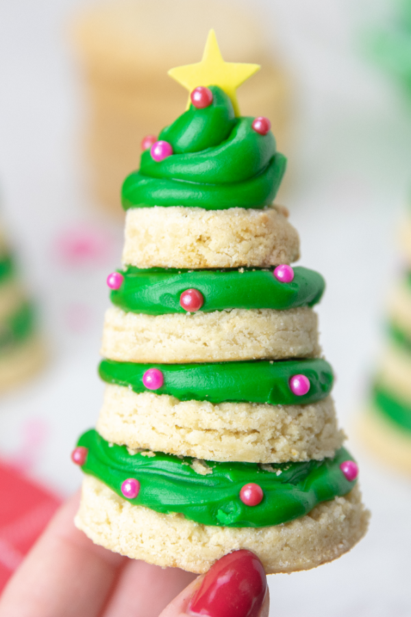 Whip up a batch of these sugar cookie Christmas Trees! These are a 3D cookie that are a stacked cookie that is festive and delicious. #passion4savings #Christmas #cookies #dessert #holiday #xmas #sugarcookie #frosting Tree Cookies