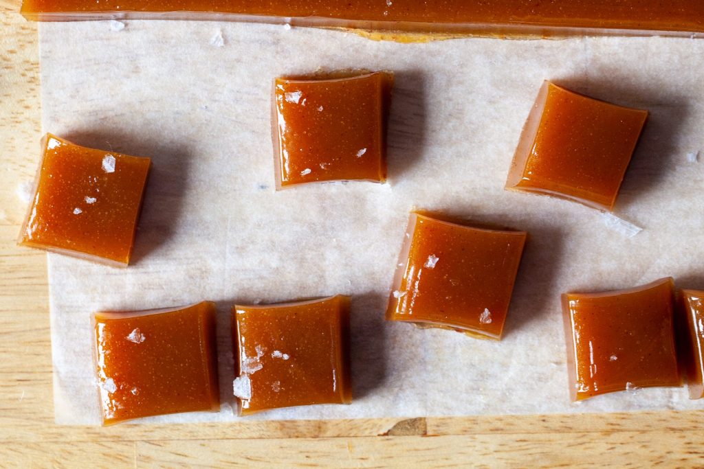 apple cider caramels on parchment paper 